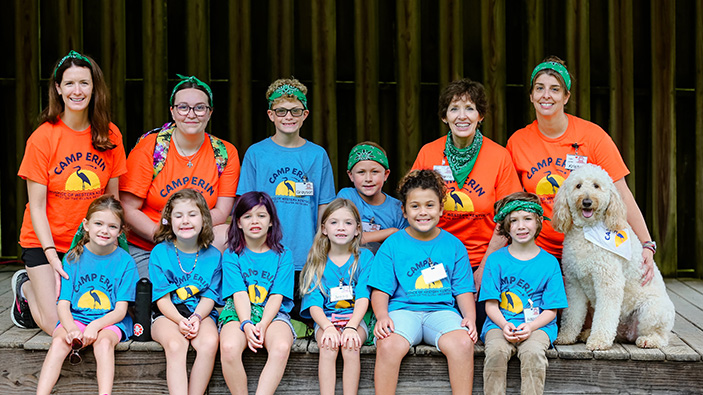 Group on camp erin campers happily smiling at the camera