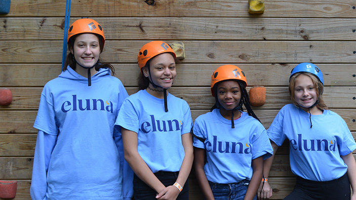 Four young kids in eluna t-shirts