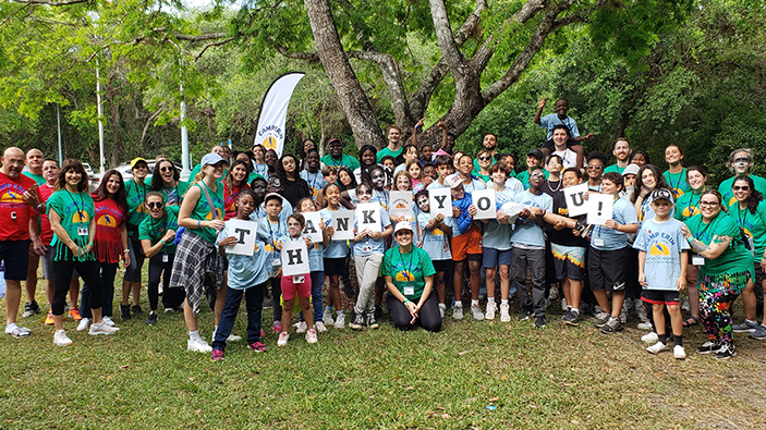 Group of Camo Erin Campers holding a thank you sign