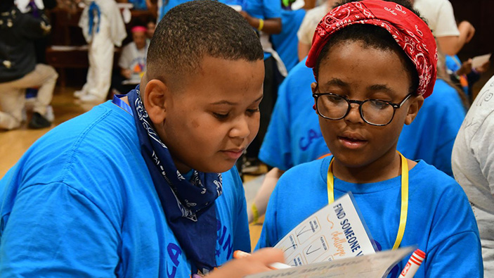 Two children doing a worksheet