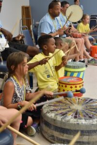 Camp Erin campers participate in a feel the beat activity