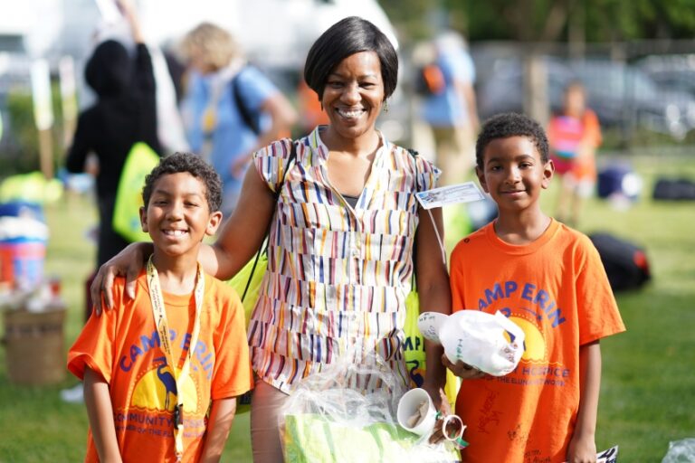 a mother picks up kids from Camp Erin