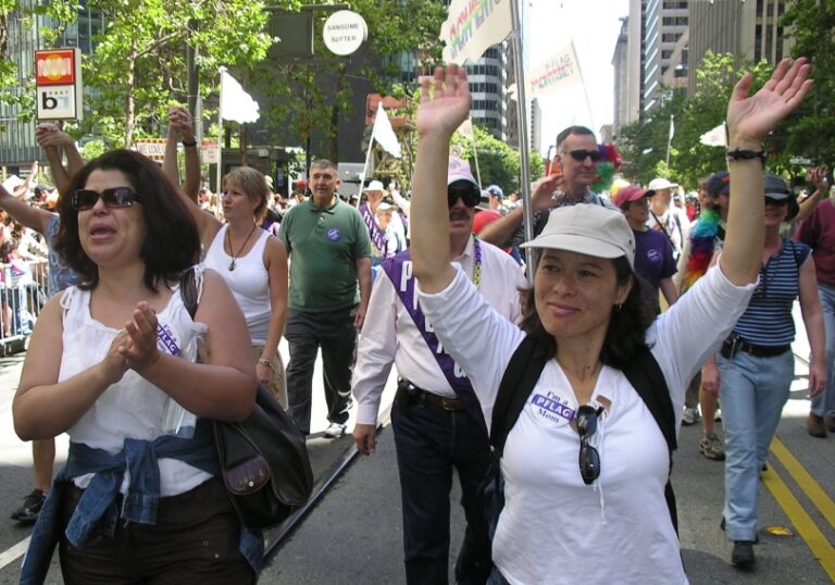 people marching in a local pride parade