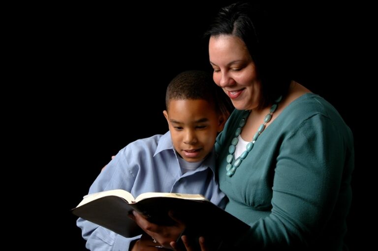 a mother and son read together