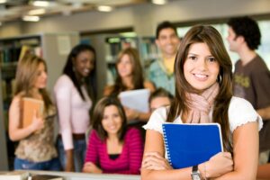 a student standing in front of a large group of students