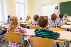 children sitting in a classroom