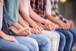 children holding hands in support of each other