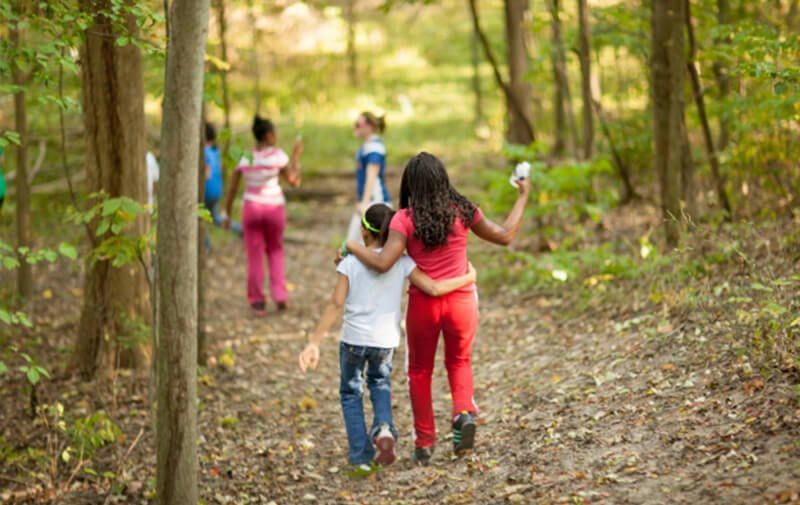 campers walking along a trail